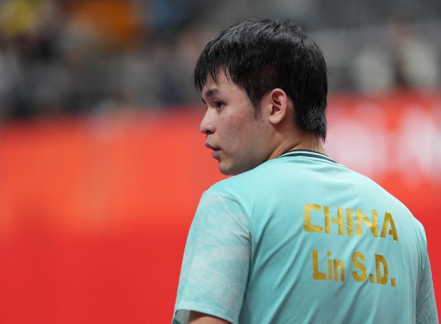 (260928) -- TOYOTA, Sept. 28, 2026 (Xinhua) -- Lin Shidong reacts during the men's singles semifinals of table tennis against Lin Yun-ju of Chinese Taipei at the 20th Asian Games Aichi-Nagoya 2026 in Toyota of Aichi Prefecture, Japan, Sept. 28, 2026. (Xinhua/Cheong Kam Ka)