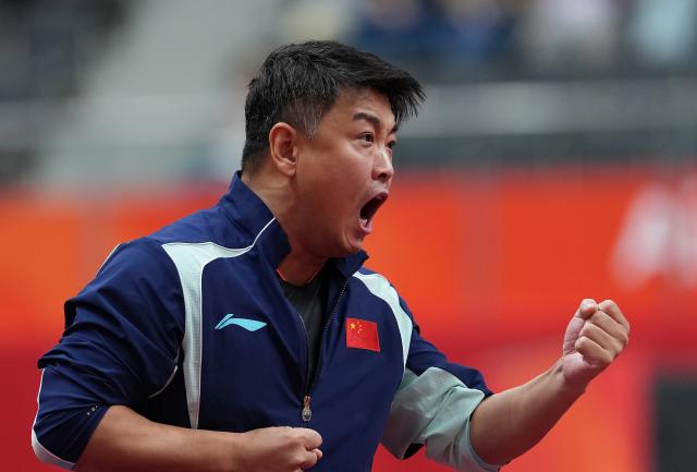 (260928) -- TOYOTA, Sept. 28, 2026 (Xinhua) -- Coach Wang Hao celebrates during the men's singles semifinals of table tennis between Lin Shidong of China and Lin Yun-ju of Chinese Taipei at the 20th Asian Games Aichi-Nagoya 2026 in Toyota of Aichi Prefecture, Japan, Sept. 28, 2026. (Xinhua/Wang Fei)