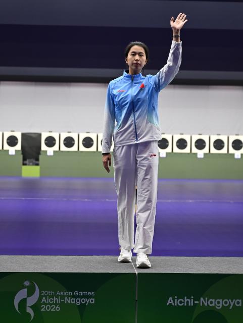 (260928) -- TOYOTA, Sept. 28, 2026 (Xinhua) -- Gold medalist Xiao Jiaruixuan of China celebrates during the victory ceremony for the 25m pistol women individual of shooting at the 20th Asian Games Aichi-Nagoya 2026 in Toyota of Aichi Prefecture, Japan, Sept. 28, 2026. (Xinhua/Liu Lei)