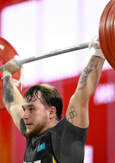 (260928) -- NAGOYA, Sept. 28, 2026 (Xinhua) -- Alexey Churkin of Kazakhstan competes during the men's 85kg final of weightlifting at the 20th Asian Games Aichi-Nagoya 2026 in Nagoya, Japan, Sept. 28, 2026. (Xinhua/Yu Yang)