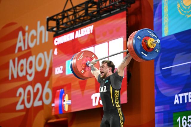(260928) -- NAGOYA, Sept. 28, 2026 (Xinhua) -- Alexey Churkin of Kazakhstan competes during the men's 85kg final of weightlifting at the 20th Asian Games Aichi-Nagoya 2026 in Nagoya, Japan, Sept. 28, 2026. (Xinhua/Yu Yang)