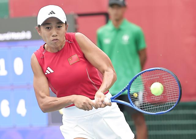 (260928) -- NAGOYA, Sept. 28, 2026 (Xinhua) -- Zhang Shuai of China hits a return during the women's singles second round match of tennis against Meshkatolzahra Safi of Iran at the 20th Asian Games Aichi-Nagoya 2026 in Nagoya, Japan, Sept. 28, 2026. (Xinhua/Long Lei)