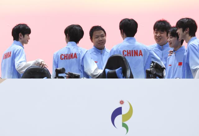 (260928) -- TOKONAME, Sept. 28, 2026 (Xinhua) -- Team China react after the Honor of Kings final of Esports between team China and team Malaysia at the 20th Asian Games Aichi-Nagoya 2026 in Tokoname of Aichi Prefecture, Japan, Sept. 28, 2026. (Xinhua/Yao Qilin)
