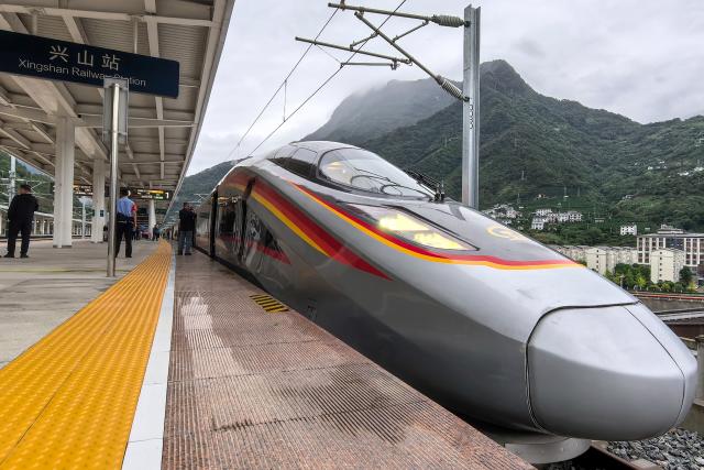 (260928) -- XINGSHAN, Sept. 28, 2026 (Xinhua) -- The first train of Yichang-Xingshan high-speed railway, G6888, is pictured ahead of its departure from Xingshan Railway Station in Xingshan County, central China's Hubei Province, Sept. 28, 2026. The 101-kilometer Yichang-Xingshan high-speed railway officially entered service on Monday. The railway, with a designed speed of 350 kilometers per hour, is an important part of the country's high-speed rail network. (Xinhua/Wang Zichen)