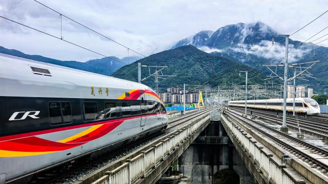 (260928) -- XINGSHAN, Sept. 28, 2026 (Xinhua) -- The first train of Yichang-Xingshan high-speed railway, G6888, departs from Xingshan Railway Station in Xingshan County, central China's Hubei Province, Sept. 28, 2026. The 101-kilometer Yichang-Xingshan high-speed railway officially entered service on Monday. The railway, with a designed speed of 350 kilometers per hour, is an important part of the country's high-speed rail network. (Photo by Zou Yuanjing/Xinhua)