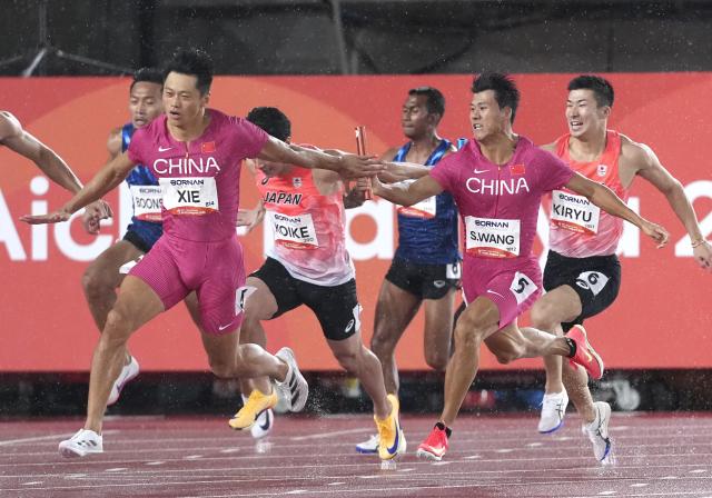 (260928) -- NAGOYA, Sept. 28, 2026 (Xinhua) -- Xie Zhenye (2nd L) and Wang Shengjie (2nd R) of Team China compete during the men's 4x100m relay final of athletics at the 20th Asian Games Aichi-Nagoya 2026 in Nagoya, Japan, Sept. 28, 2026. (Xinhua/Luo Yuan)