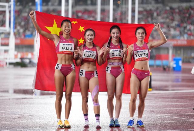 (260928) -- NAGOYA, Sept. 28, 2026 (Xinhua) -- Gold medalists Liu Guoyi, Liang Xiaojing, Liu Xiajun and Chen Yujie (from L to R) of team China celebrate after the women's 4x100m relay final of athletics at the 20th Asian Games Aichi-Nagoya 2026 in Nagoya, Japan, Sept. 28, 2026. (Xinhua/Lui Siu Wai)