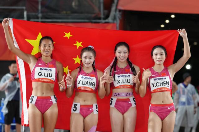 (260928) -- NAGOYA, Sept. 28, 2026 (Xinhua) -- Liu Guoyi, Liang Xiaojing, Liu Xiajun and Chen Yujie (from L to R) of China pose for photo after the women's 4x100M relay final of Athletics at the 20th Asian Games Aichi-Nagoya 2026 in Nagoya, Japan, Sept. 28, 2026. (Xinhua/Luo Yuan)