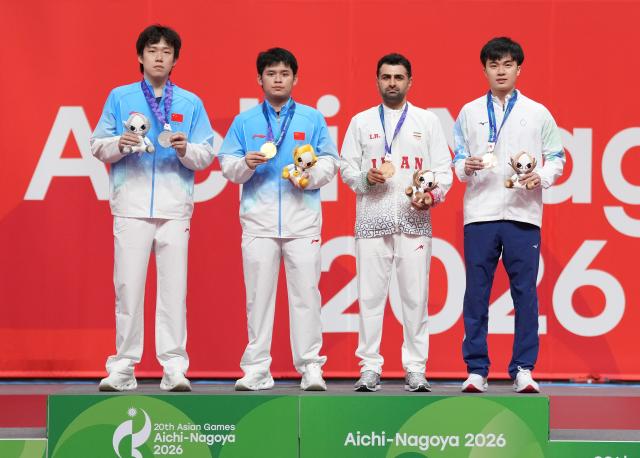 (260928) -- TOYOTA, Sept. 28, 2026 (Xinhua) -- Gold medalist Lin Shidong (2nd L) of China, silver medalist Wang Chuqin (1st L) of China, bronze medalist Noshad Alamiyan (2nd R) of Iran and Lin Yun-ju of Chinese Taipei pose during the awarding ceremony for the men's singles of table tennis at the 20th Asian Games Aichi-Nagoya 2026 in Toyota of Aichi Prefecture, Japan, Sept. 28, 2026. (Xinhua/Cheong Kam Ka)