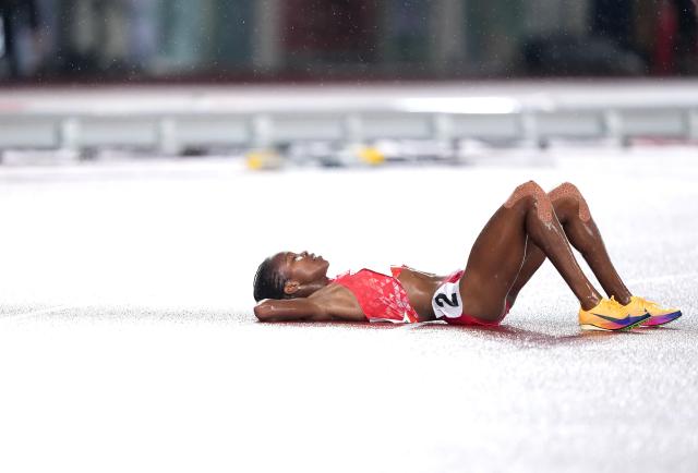(260928) -- NAGOYA, Sept. 28, 2026 (Xinhua) -- Winfred Yavi of Bahrain reacts after the women's 5000m final match of Athletics at the 20th Asian Games Aichi-Nagoya 2026 in Nagoya, Japan, Sept. 28, 2026. (Xinhua/Jia Yuchen)