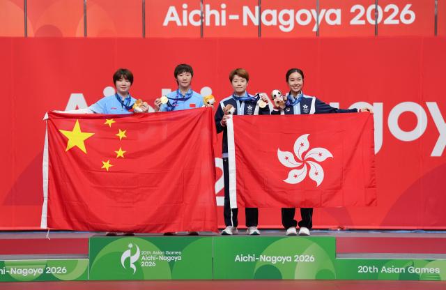 (260928) -- TOYOTA, Sept. 28, 2026 (Xinhua) -- Gold medalists Kuai Man (1st L)/Wang Manyu (2st L) of China pose with bronze medalists Doo Hoi Kem (2nd R)/Ng Wing Lam of Hong Kong of China during the awarding ceremony for the women's doubles of table tennis at the 20th Asian Games Aichi-Nagoya 2026 in Toyota of Aichi Prefecture, Japan, Sept. 28, 2026. (Xinhua/Wang Fei)