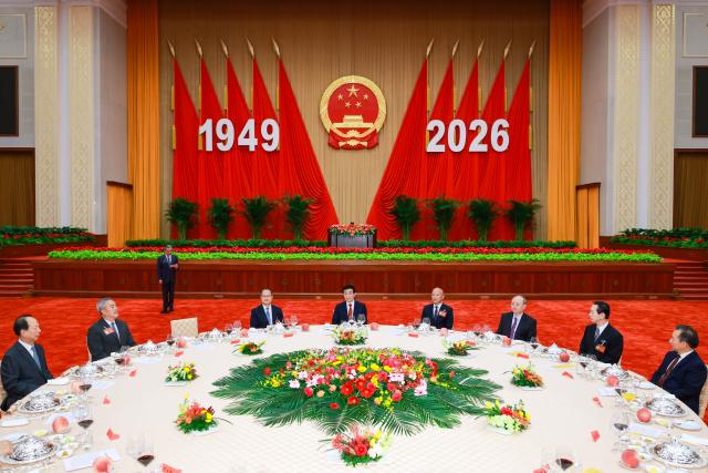 (260928) -- BEIJING, Sept. 28, 2026 (Xinhua) -- Wang Huning, a member of the Standing Committee of the Political Bureau of the Communist Party of China (CPC) Central Committee and chairman of the National Committee of the Chinese People's Political Consultative Conference, attends a reception to celebrate the upcoming 77th anniversary of the founding of the People's Republic of China and delivers a speech at the Great Hall of the People in Beijing, capital of China, Sept. 28, 2026. (Xinhua/Liu Bin)