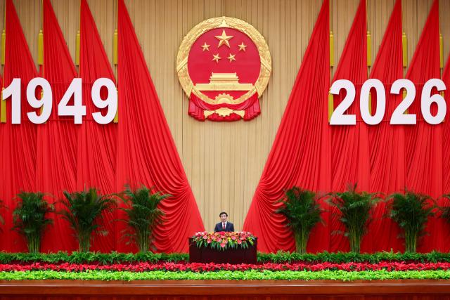 (260928) -- BEIJING, Sept. 28, 2026 (Xinhua) -- Wang Huning, a member of the Standing Committee of the Political Bureau of the Communist Party of China (CPC) Central Committee and chairman of the National Committee of the Chinese People's Political Consultative Conference, attends a reception to celebrate the upcoming 77th anniversary of the founding of the People's Republic of China and delivers a speech at the Great Hall of the People in Beijing, capital of China, Sept. 28, 2026. (Xinhua/Liu Bin)