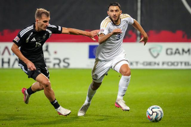 (260929) -- RIGA, Sept. 29, 2026 (Xinhua) -- Latvian player Dmitrijs Zelenkovs (L) vies with Nikolaos Panagiotou of Cyprus during the League C match of UEFA Nations League between Latvia and Cyprus in Riga, Latvia, Sept. 28, 2026. (Photo by Edijs Palens/Xinhua)