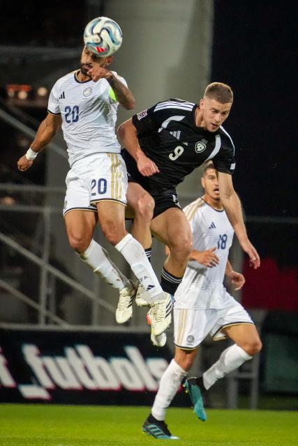 (260929) -- RIGA, Sept. 29, 2026 (Xinhua) -- Latvian player Vladislavs Gutkovskis (top R) vies with Grigoris Kastanos of Cyprus during the League C match of UEFA Nations League between Latvia and Cyprus in Riga, Latvia, Sept. 28, 2026. (Photo by Edijs Palens/Xinhua)