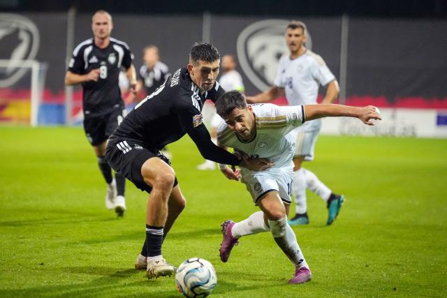 (260929) -- RIGA, Sept. 29, 2026 (Xinhua) -- Latvian player Deniss Melniks (L) vies with Loizos Loizou of Cyprus during the League C match of UEFA Nations League between Latvia and Cyprus in Riga, Latvia, Sept. 28, 2026. (Photo by Edijs Palens/Xinhua)