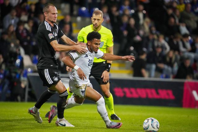 (260929) -- RIGA, Sept. 29, 2026 (Xinhua) -- Latvian player Eduards Emsis (L) vies with Marcus Edwards of Cyprus during the League C match of UEFA Nations League between Latvia and Cyprus in Riga, Latvia, Sept. 28, 2026. (Photo by Edijs Palens/Xinhua)