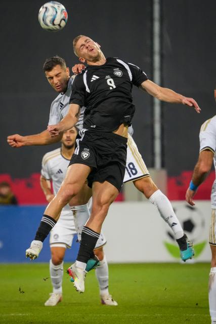 (260929) -- RIGA, Sept. 29, 2026 (Xinhua) -- Latvian player Vladislavs Gutkovskis (R) vies with Kostakis Artymatas of Cyprus during the League C match of UEFA Nations League between Latvia and Cyprus in Riga, Latvia, Sept. 28, 2026. (Photo by Edijs Palens/Xinhua)