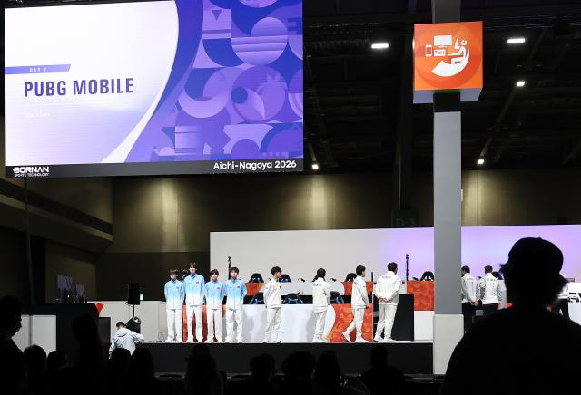 (260929) -- TOKONAME, Sept. 29, 2026 (Xinhua) -- Team China (L) line up ahead of the Battle Royale [PUBG MOBILE - Asian Games Version] finals of Esports at the 20th Asian Games Aichi-Nagoya 2026 in Tokoname of Aichi Prefecture, Japan, Sept. 29, 2026. (Xinhua/Yao Qilin)