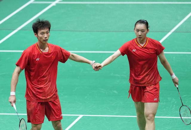 (260929) -- ICHINOMIYA, Sept. 29, 2026 (Xinhua) -- Jiang Zhenbang (L)/Wei Yaxin of China celebrate scoring during the mixed doubles final of badminton between Amri Syahnawi/Nita Violina Marwah of Indonesia and Jiang Zhenbang/Wei Yaxin of China at the 20th Asian Games Aichi-Nagoya 2026 in Ichinomiya of Aichi Prefecture, Japan, Sept. 29, 2026. (Xinhua/Cheong Kam Ka)