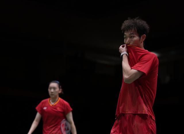 (260929) -- ICHINOMIYA, Sept. 29, 2026 (Xinhua) -- Jiang Zhenbang (R)/Wei Yaxin of China react during the mixed doubles final of badminton between Amri Syahnawi/Nita Violina Marwah of Indonesia and Jiang Zhenbang/Wei Yaxin of China at the 20th Asian Games Aichi-Nagoya 2026 in Ichinomiya of Aichi Prefecture, Japan, Sept. 29, 2026. (Xinhua/Li Bo)