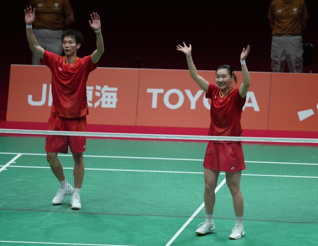 (260929) -- ICHINOMIYA, Sept. 29, 2026 (Xinhua) -- Jiang Zhenbang (L)/Wei Yaxin of China celebrate after winning the mixed doubles final of badminton between Amri Syahnawi/Nita Violina Marwah of Indonesia and Jiang Zhenbang/Wei Yaxin of China at the 20th Asian Games Aichi-Nagoya 2026 in Ichinomiya of Aichi Prefecture, Japan, Sept. 29, 2026. (Xinhua/Cheong Kam Ka)