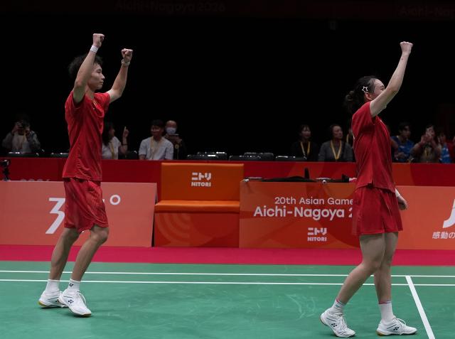 (260929) -- ICHINOMIYA, Sept. 29, 2026 (Xinhua) -- Jiang Zhenbang (L)/Wei Yaxin of China celebrate after the mixed doubles final of badminton against Amri Syahnawi/Nita Violina Marwah of Indonesia at the 20th Asian Games Aichi-Nagoya 2026 in Ichinomiya of Aichi Prefecture, Japan, Sept. 29, 2026. (Xinhua/Li Bo)