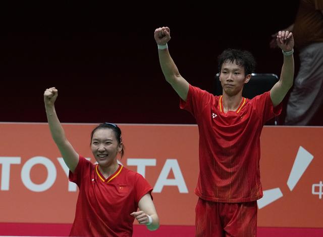 (260929) -- ICHINOMIYA, Sept. 29, 2026 (Xinhua) -- Jiang Zhenbang (R)/Wei Yaxin of China celebrate after the mixed doubles final of badminton against Amri Syahnawi/Nita Violina Marwah of Indonesia at the 20th Asian Games Aichi-Nagoya 2026 in Ichinomiya of Aichi Prefecture, Japan, Sept. 29, 2026. (Xinhua/Cheong Kam Ka)