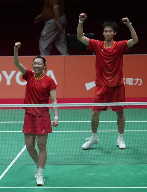 (260929) -- ICHINOMIYA, Sept. 29, 2026 (Xinhua) -- Jiang Zhenbang (R)/Wei Yaxin of China celebrate after the mixed doubles final of badminton against Amri Syahnawi/Nita Violina Marwah of Indonesia at the 20th Asian Games Aichi-Nagoya 2026 in Ichinomiya of Aichi Prefecture, Japan, Sept. 29, 2026. (Xinhua/Cheong Kam Ka)