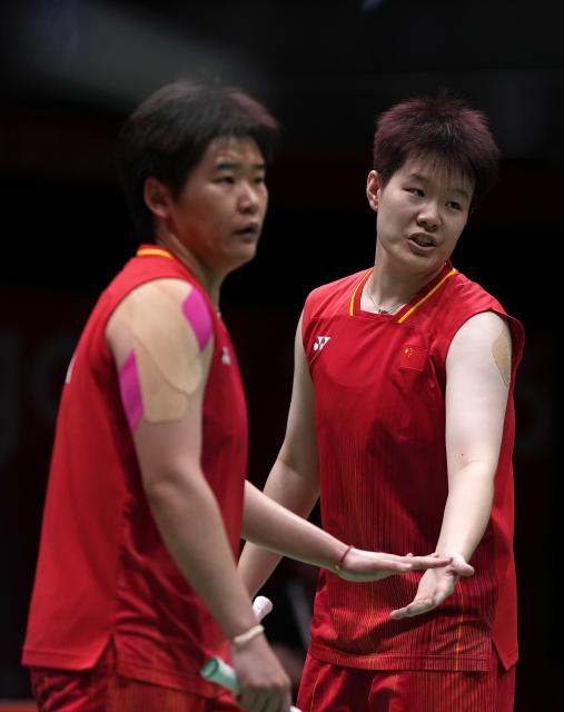 (260929) -- ICHINOMIYA, Sept. 29, 2026 (Xinhua) -- Liu Shengshu (R)/Tan Ning of China react during the women's doubles final of badminton against Lee Sohee/Baek Hana of South Korea at the 20th Asian Games Aichi-Nagoya 2026 in Ichinomiya of Aichi Prefecture, Japan, Sept. 29, 2026. (Xinhua/Li Bo)