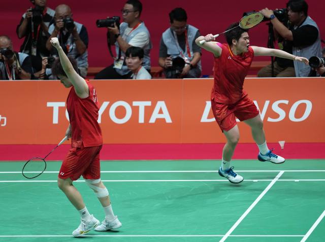 (260929) -- ICHINOMIYA, Sept. 29, 2026 (Xinhua) -- Liu Shengshu/Tan Ning (R) of China celebrate during the women's doubles final of badminton against Lee Sohee/Baek Hana of South Korea at the 20th Asian Games Aichi-Nagoya 2026 in Ichinomiya of Aichi Prefecture, Japan, Sept. 29, 2026. (Xinhua/Cheong Kam Ka)