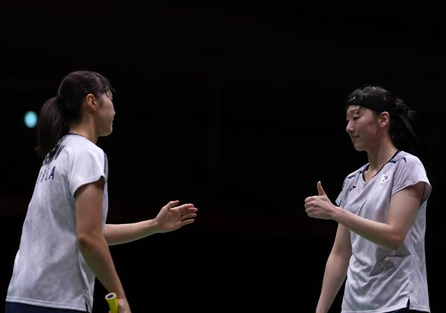 (260929) -- ICHINOMIYA, Sept. 29, 2026 (Xinhua) -- Lee Sohee (R)/Baek Hana of South Korea react during the women's doubles final of badminton against Liu Shengshu/Tan Ning of China at the 20th Asian Games Aichi-Nagoya 2026 in Ichinomiya of Aichi Prefecture, Japan, Sept. 29, 2026. (Xinhua/Li Bo)