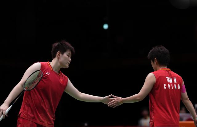 (260929) -- ICHINOMIYA, Sept. 29, 2026 (Xinhua) -- Liu Shengshu (L)/Tan Ning of China react during the women's doubles final of badminton against Lee Sohee/Baek Hana of South Korea at the 20th Asian Games Aichi-Nagoya 2026 in Ichinomiya of Aichi Prefecture, Japan, Sept. 29, 2026. (Xinhua/Li Bo)