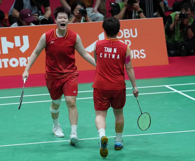 (260929) -- ICHINOMIYA, Sept. 29, 2026 (Xinhua) -- Liu Shengshu (L)/Tan Ning of China celebrate during the women's doubles final of badminton against Lee Sohee/Baek Hana of South Korea at the 20th Asian Games Aichi-Nagoya 2026 in Ichinomiya of Aichi Prefecture, Japan, Sept. 29, 2026. (Xinhua/Cheong Kam Ka)