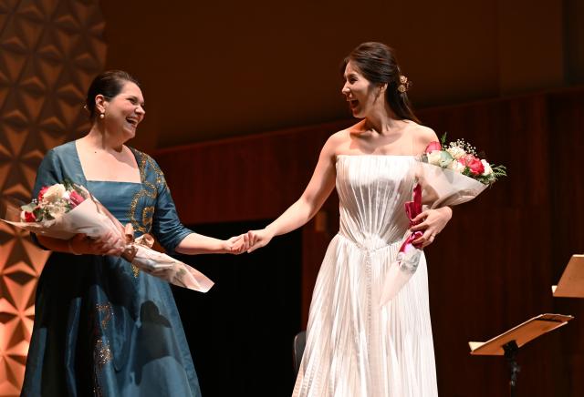 (260929) -- RIO DE JANEIRO, Sept. 29, 2026 (Xinhua) -- Sopranos Yu Xi (R) and Marilia Vargas shake hands after a concert tour in Rio de Janeiro, Brazil, Sept. 28, 2026. Themed "From the Yangtze to the Amazon," the Brazil edition of the concert tour made its debut at the Cecilia Meireles Hall in Rio de Janeiro on Monday. As a side event marking the "China-Brazil Cultural Year," the Brazil edition of the concert tour will be staged in Brasilia, Belem and Sao Paulo as well. (Xinhua/Jin Haoyuan)