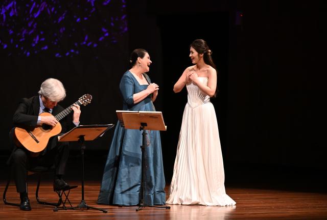 (260929) -- RIO DE JANEIRO, Sept. 29, 2026 (Xinhua) -- Sopranos Yu Xi (R) and Marilia Vargas (C) perform during a concert tour in Rio de Janeiro, Brazil, Sept. 28, 2026. Themed "From the Yangtze to the Amazon," the Brazil edition of the concert tour made its debut at the Cecilia Meireles Hall in Rio de Janeiro on Monday. As a side event marking the "China-Brazil Cultural Year," the Brazil edition of the concert tour will be staged in Brasilia, Belem and Sao Paulo as well. (Xinhua/Jin Haoyuan)