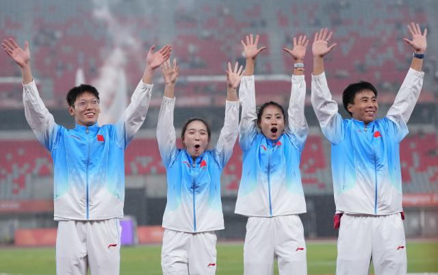 (260929) -- NAGOYA, Sept. 29, 2026 (Xinhua) -- Gold medalists Shi Junhao, Chen Yujie, Liu Guoyi and Chen Jinfeng (L-R) of team China celebrate during the awarding ceremony for the 4x100m mixed relay final of Athletics at the 20th Asian Games Aichi-Nagoya 2026 in Nagoya, Japan, Sept. 29, 2026. (Xinhua/Jia Yuchen)