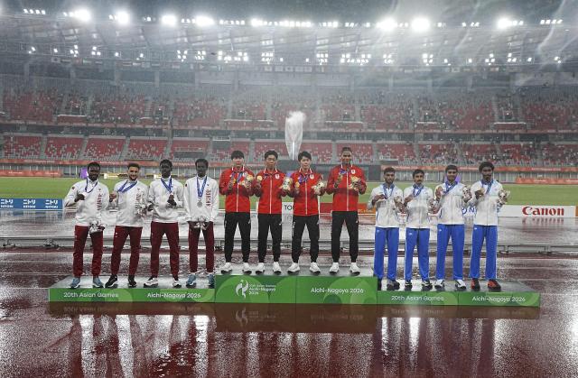 (260929) -- NAGOYA, Sept. 29, 2026 (Xinhua) -- Gold medalist team Japan (C), silver medalist team Qatar (L), bronze medalist team India pose for photos during the awarding ceremony for the men's 4x400m relay final of Athletics at the 20th Asian Games Aichi-Nagoya 2026 in Nagoya, Japan, Sept. 29, 2026. (Xinhua/Luo Yuan)