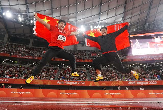 (260929) -- NAGOYA, Sept. 29, 2026 (Xinhua) -- Zhang Jiale (L) and Zhao Jie of China celebrate after the women's hammer throw final of Athletics at the 20th Asian Games Aichi-Nagoya 2026 in Nagoya, Japan, Sept. 29, 2026. (Xinhua/Luo Yuan)