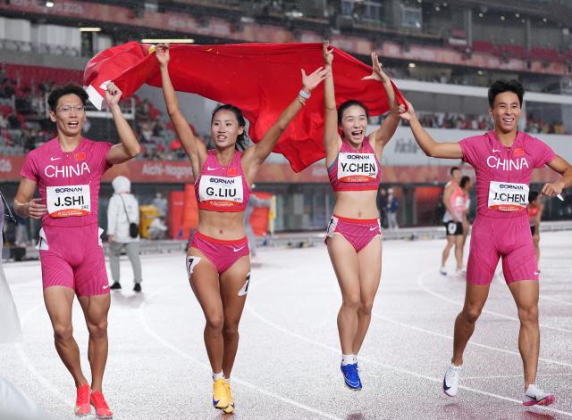 (260929) -- NAGOYA, Sept. 29, 2026 (Xinhua) -- Shi Junhao, Liu Guoyi, Chen Yujie and Chen Jinfeng (L to R) of team China celebrate after the 4x100m relay mixed final of athletics at the 20th Asian Games Aichi-Nagoya 2026 in Nagoya, Japan, Sept. 29, 2026. (Xinhua/Jia Yuchen)