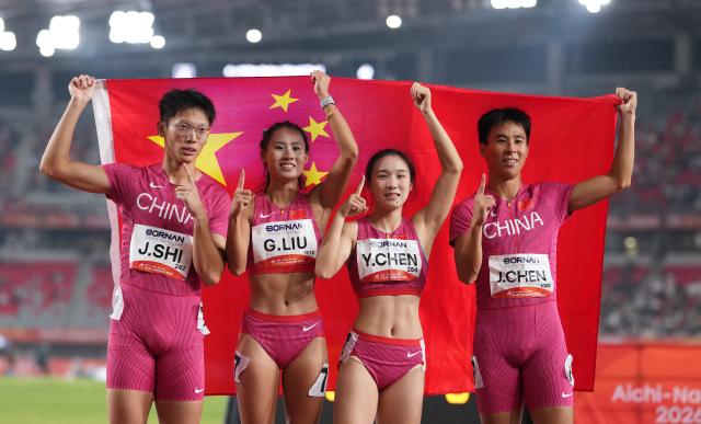 (260929) -- NAGOYA, Sept. 29, 2026 (Xinhua) -- Shi Junhao, Liu Guoyi, Chen Yujie and Chen Jinfeng (L to R) of China celebrate after the 4x100m relay mixed final of athletics at the 20th Asian Games Aichi-Nagoya 2026 in Nagoya, Japan, Sept. 29, 2026. (Xinhua/Lui Siu Wai)