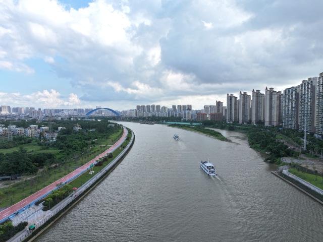 (260929) -- QINZHOU, Sept. 29, 2026 (Xinhua) -- An aerial drone photo taken on Sept. 29, 2026 shows cruise boats at a waterway service area of Pinglu Canal in Qinzhou, south China's Guangxi Zhuang Autonomous Region. Tourism is booming along the Pinglu Canal in Guangxi recently. Many tourists take boat tours to view waterways, navigation hubs and bridges of the canal and enjoy the scenery along it. 
  The Pinglu Canal, officially opened to navigation on Sept. 16, links the Xijiang River shipping route with the Beibu Gulf, acting as a vital link connecting China's inland waterways with the sea. (Xinhua/Zhou Hua)