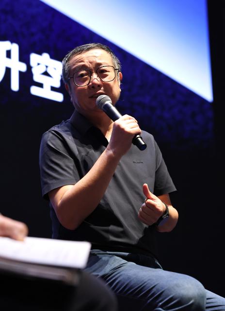 (260930) -- SHANGHAI, Sept. 30, 2026 (Xinhua) -- Liu Cixin talks with guests and audiences during the launch event for an immersive sci-fi fairy-tale experience space inspired by his "The Fire Keeper" at the Shanghai Science and Technology Museum in Shanghai, east China, Sept. 29, 2026. A launch event for an immersive sci-fi fairy-tale experience space inspired by writer Liu Cixin's "The Fire Keeper" was held here on Tuesday. (Xinhua/Fang Zhe)