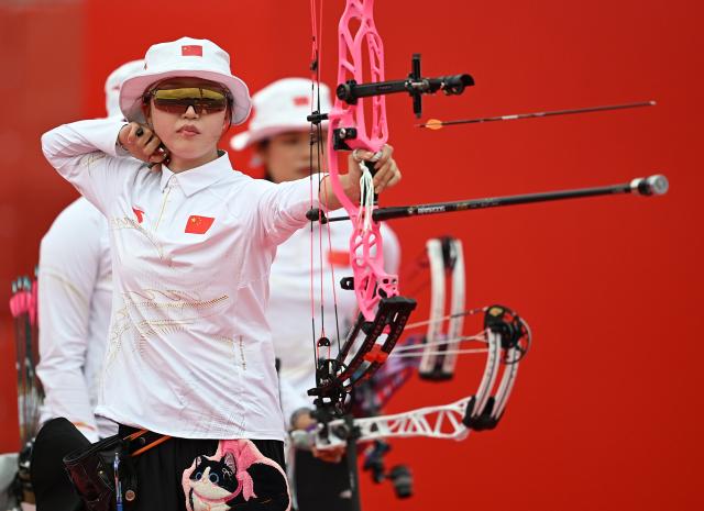 (260930) -- OKAZAKI, Sept. 30, 2026 (Xinhua) -- Wunier of team China competes during the compound women's team gold medal match of archery between China and India at the 20th Asian Games Aichi-Nagoya 2026 in Okazaki of Aichi Prefecture, Japan, Sept. 30, 2026. (Xinhua/Yu Yang)
