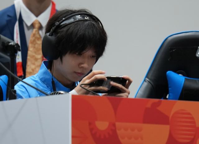 (260930) -- TOKONAME, Sept. 30, 2026 (Xinhua) -- Shi Xiangwei of team China competes during the Quarterfinals between team China and team South Korea of 1v4 asymmetrical survival game [Identity V - Asian Games Version] of Esports at the 20th Asian Games Aichi-Nagoya 2026 in Tokoname of Aichi Prefecture, Japan, Sept. 30, 2026. (Xinhua/Wang Fei)