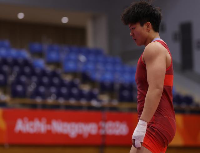 (260930) -- NAGOYA, Sept. 30, 2026 (Xinhua) -- Long Jia of China reacts after competing with Ishii Ami of Japan during the Women's 68kg Semifinals of Wrestling at the 20th Asian Games Aichi-Nagoya 2026 in Nagoya, Japan, Sept. 30, 2026. (Xinhua/Li Bo)