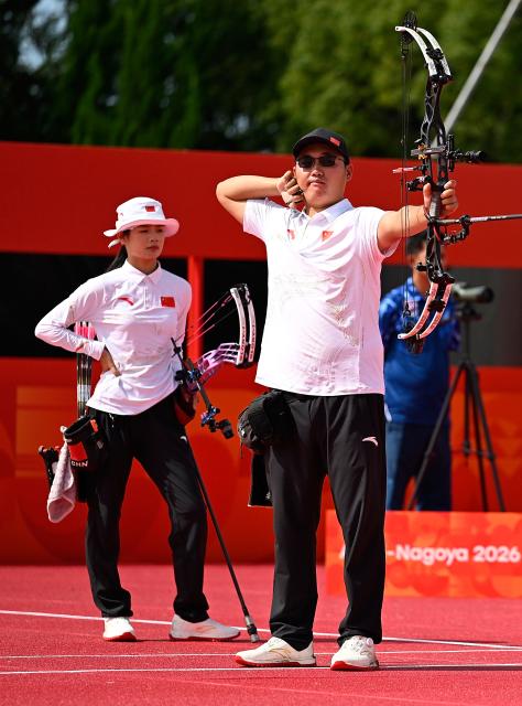 (260930) -- OKAZAKI, Sept. 30, 2026 (Xinhua) -- Liu Jinyi (R) of China competes during the compound mixed team bronze medal match of archery between China and Thailand at the 20th Asian Games Aichi-Nagoya 2026 in Okazaki of Aichi Prefecture, Japan, Sept. 30, 2026. (Xinhua/Yu Yang)