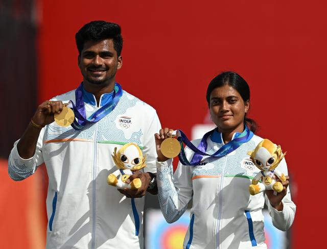 (260930) -- OKAZAKI, Sept. 30, 2026 (Xinhua) -- Gold medalists Chikitha Taniparthi (R) and Sahil Rajesh Jadhav of India pose for photos during the victory ceremony for the compound mixed team of archery at the 20th Asian Games Aichi-Nagoya 2026 in Okazaki of Aichi Prefecture, Japan, Sept. 30, 2026. (Xinhua/Yu Yang)
