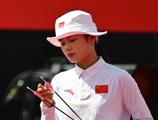 (260930) -- OKAZAKI, Sept. 30, 2026 (Xinhua) -- Wei Fangyao of China reacts during the compound mixed team bronze medal match of archery between China and Thailand at the 20th Asian Games Aichi-Nagoya 2026 in Okazaki of Aichi Prefecture, Japan, Sept. 30, 2026. (Xinhua/Yu Yang)