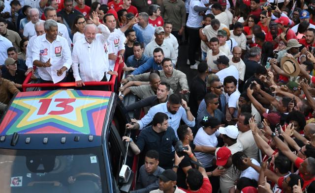 (260930) -- SALVADOR, Sept. 30, 2026 (Xinhua) -- Brazilian President Luiz Inacio Lula da Silva (R, on the vehicle), also the presidential candidate of Brazil's ruling Workers' Party, greets voters during a campaign event in Salvador, Bahia State, Brazil, on Sept. 29, 2026. (Photo by Lucio Tavora/Xinhua)
